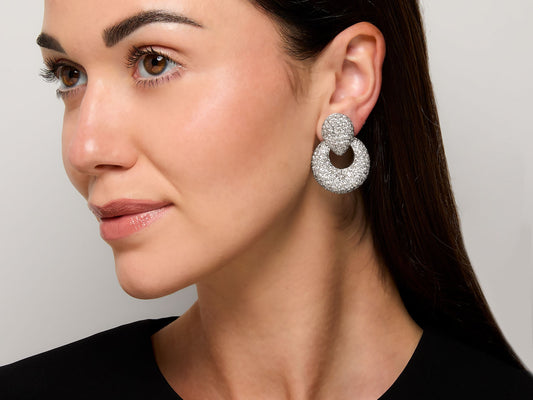 Model wearing a pave diamond door knocker earring