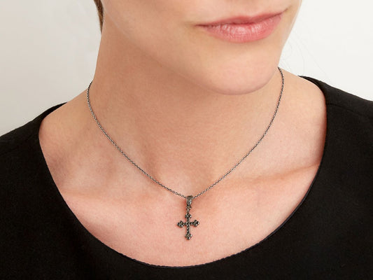 Black diamond cross pendant necklace worn on a model