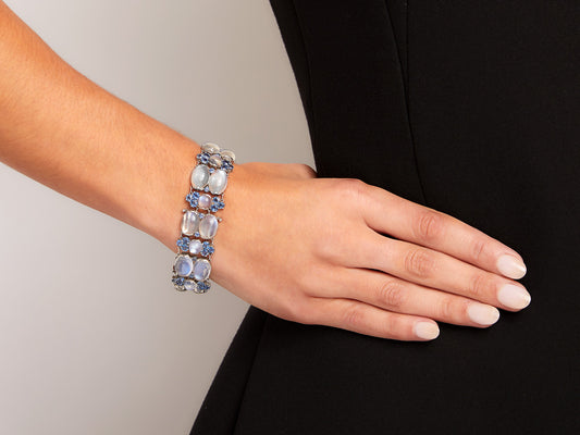 Platinum bracelet with moonstones and blue sapphires worn on wrist