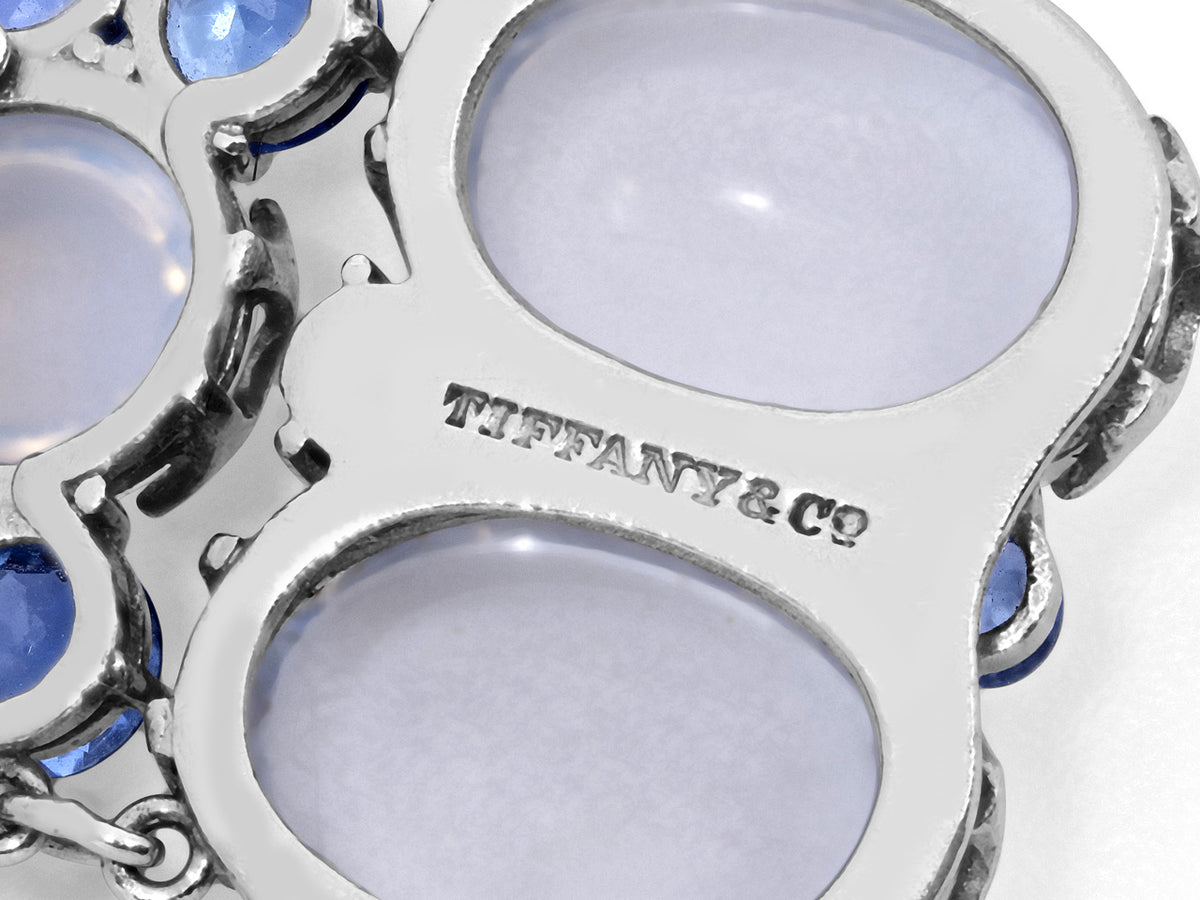 Close up of platinum bracelet with moonstones and sapphire accents
