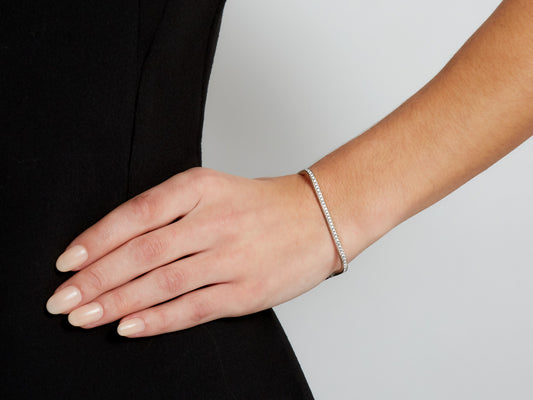 18K white gold diamond square bangle worn on wrist