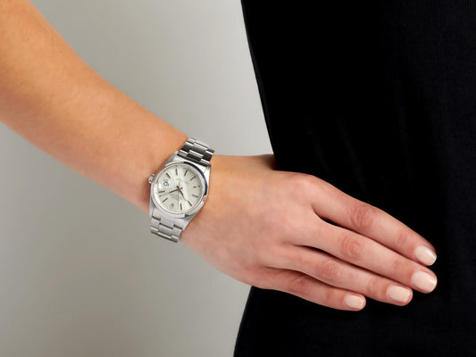 Stainless steel Rolex Datejust watch worn on wrist