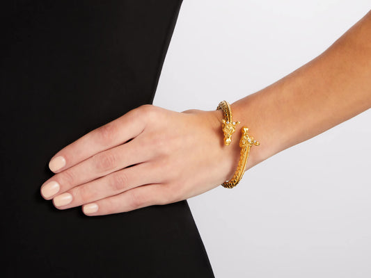 Model wearing an 18K gold giraffe head bangle