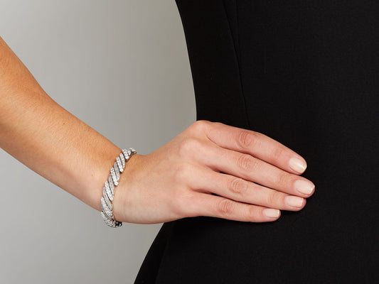 Platinum bracelet with alternating diamond rows on wrist