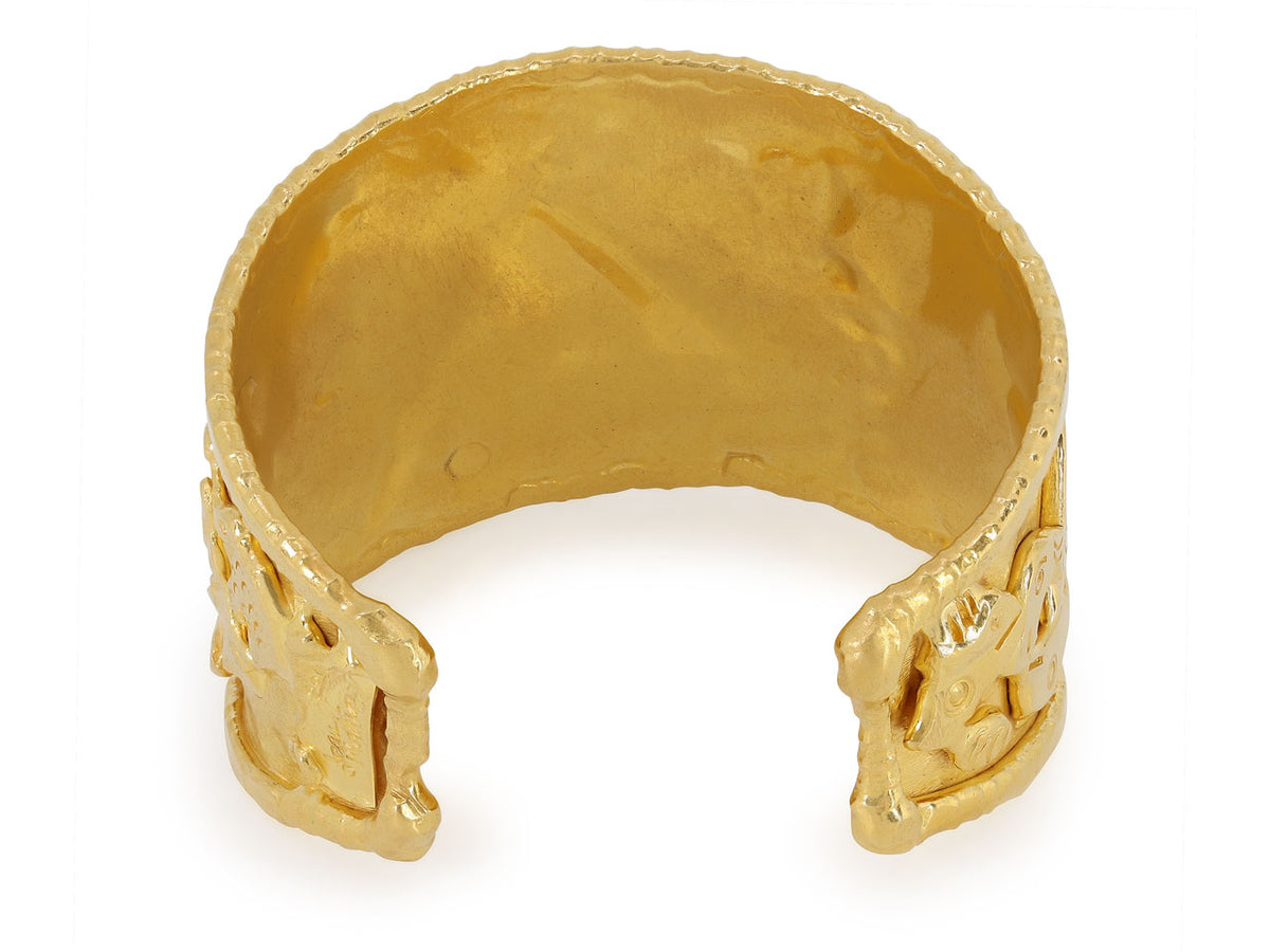 Textured 22K gold cuff bracelet with abstract figures