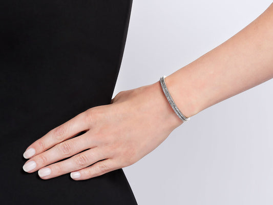 Pair of flexible diamond bangles in white gold
