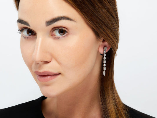 Woman wearing a Bulgari diamond drop earring