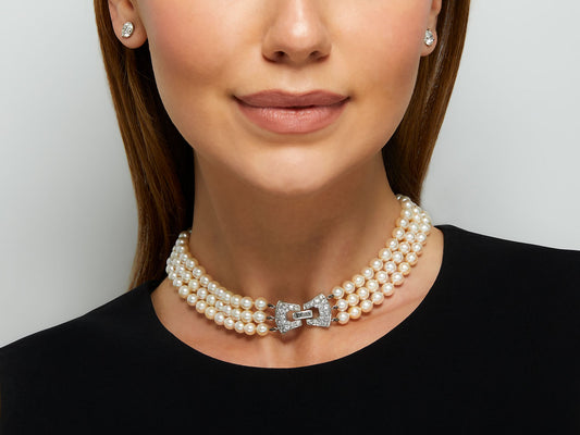 Three strand pearl necklace with diamond clasp