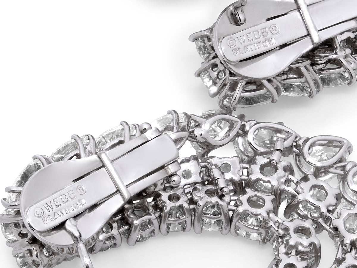 Close view of platinum diamond hoop earring clasps
