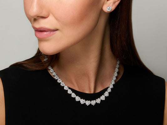 Diamond heart necklace in 18K white gold worn on model