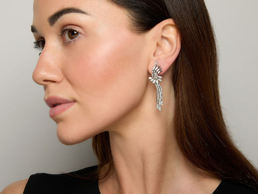 Woman wearing a platinum diamond fan drop earring