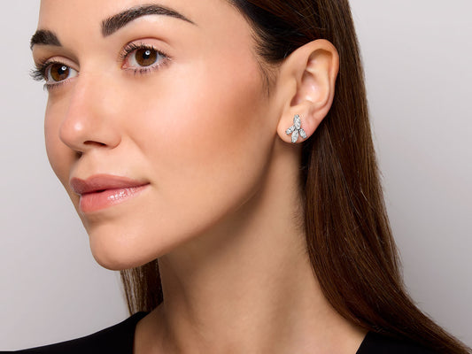 Woman wearing a platinum marquise diamond cluster earring