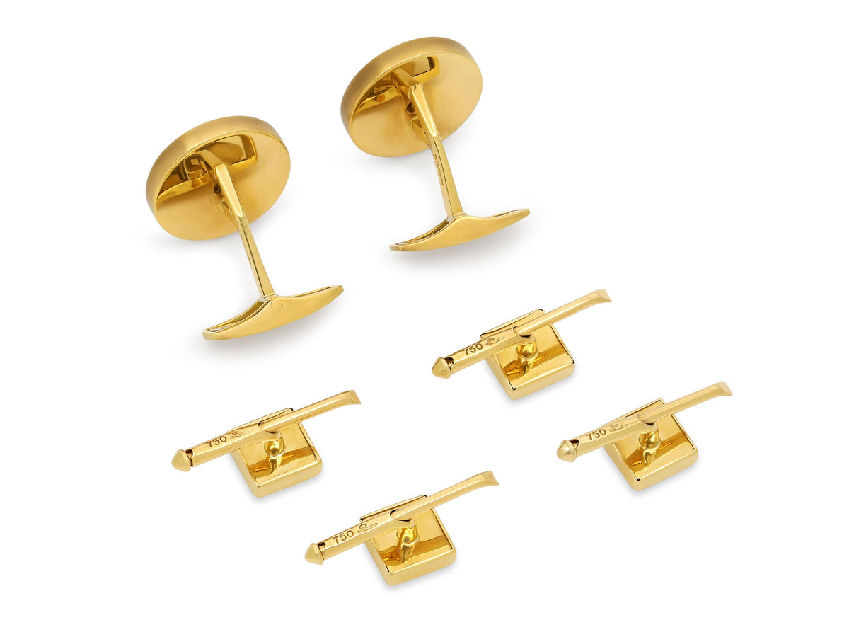 Rear view of yellow gold cufflinks and four shirt studs