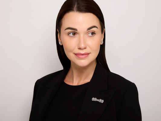 Antique Edwardian Diamond and Onyx Bow Brooch in Platinum