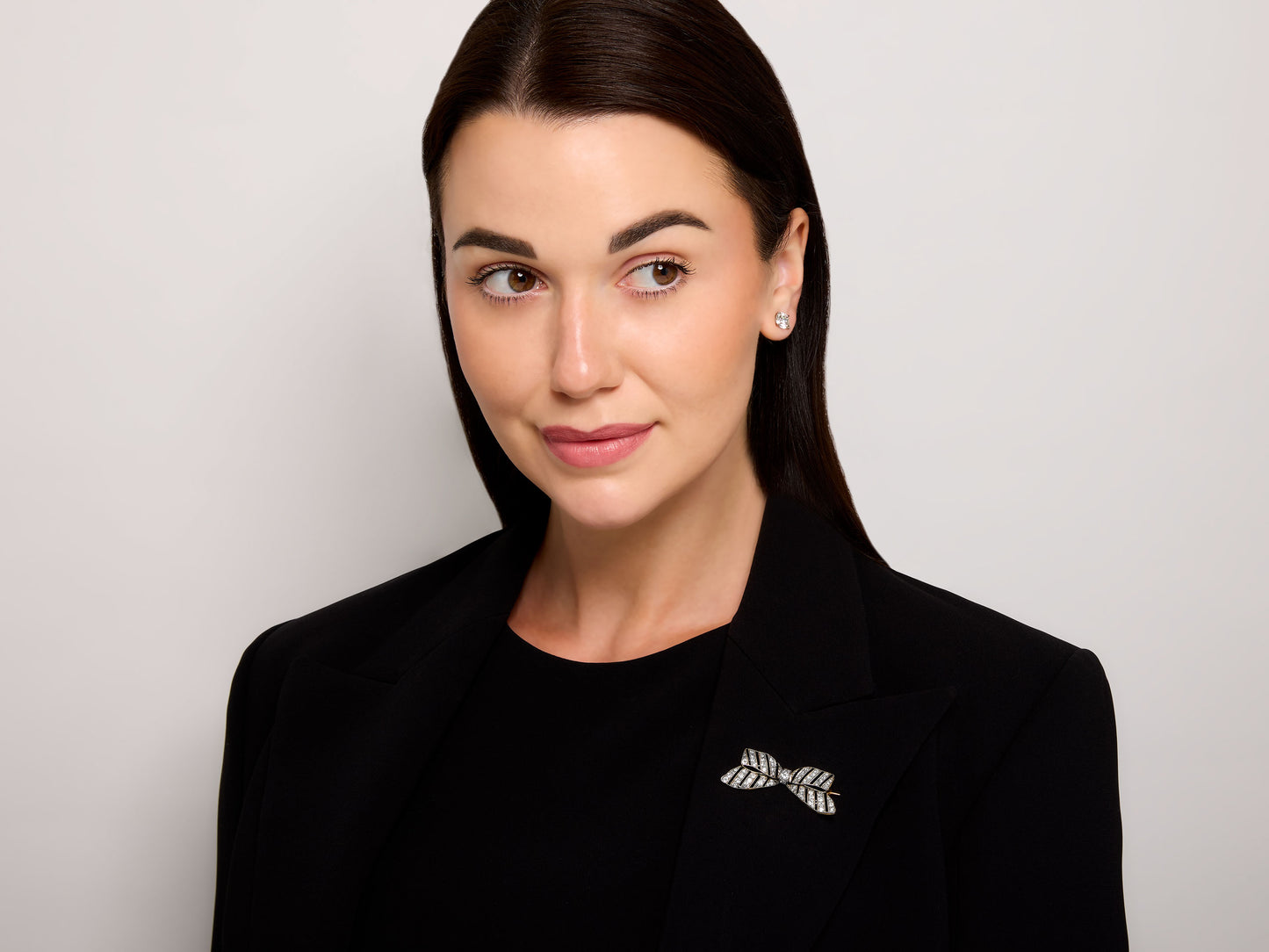 Antique Edwardian Diamond and Onyx Bow Brooch in Platinum over 18K Gold