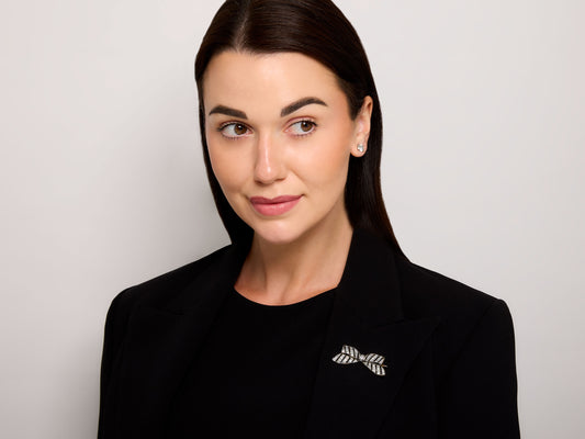 Antique Edwardian Diamond and Onyx Bow Brooch in Platinum over 18K Gold