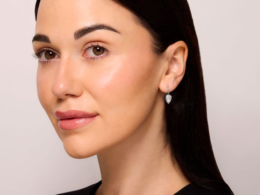 Beladora 'Bespoke' Pear-shape Diamond Drop Earrings, 3.26 carats total, in Platinum, shown on a model with a pear shape diamond earring.