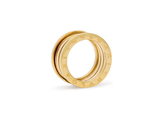 Bulgari 'B.zero1' Ring in 18K Gold, wide yellow gold band with B.zero1 motif and BVLGARI engraving, shown on white background by Beladora