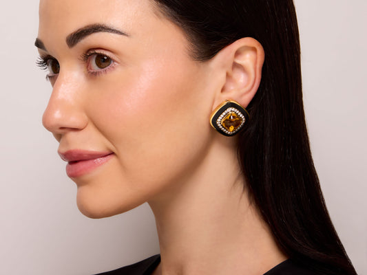 de Vroomen Diamond, Citrine and Enamel Earrings in 18K Gold worn by a model, featuring a cabochon citrine, pavé diamonds, and black enamel