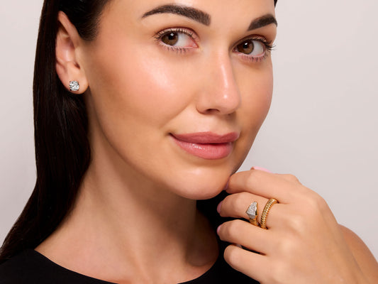 Viper Snake Diamond Ring in 18k Gold, by Beladora, modeled on a hand with a flexible coiled bypass design and pavé diamond snake head
