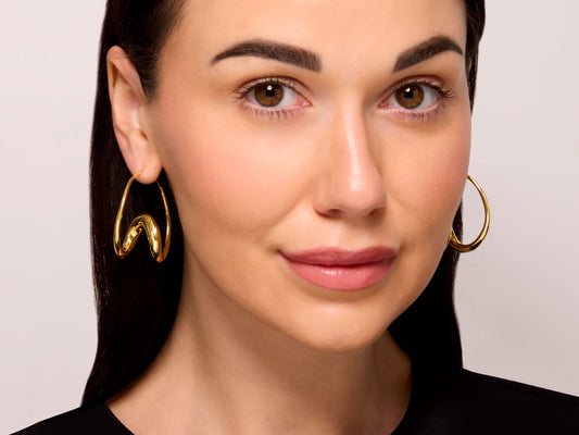 Michael Good 'Single Loop' Earrings in 18k Gold, Large, shown worn as polished twisted hoop earrings from Beladora vintage designer jewelry