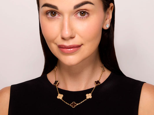 Van Cleef & Arpels 'Vintage Alhambra' Bois d'Amourette Necklace, 10 motifs, in 18K Rose Gold worn by a model, featuring alternating letterwood and textured gold motifs from Beladora