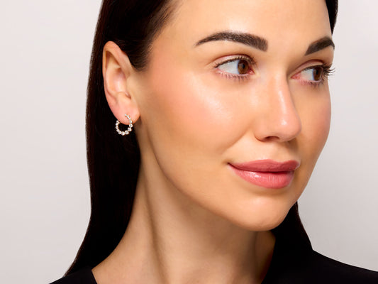 Front Back Diamond Earrings in 18K Yellow Gold worn by a model, featuring a semicircular arrangement of round diamonds in a yellow gold setting