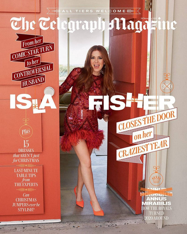 Magazine cover featuring a red haired woman in a doorway