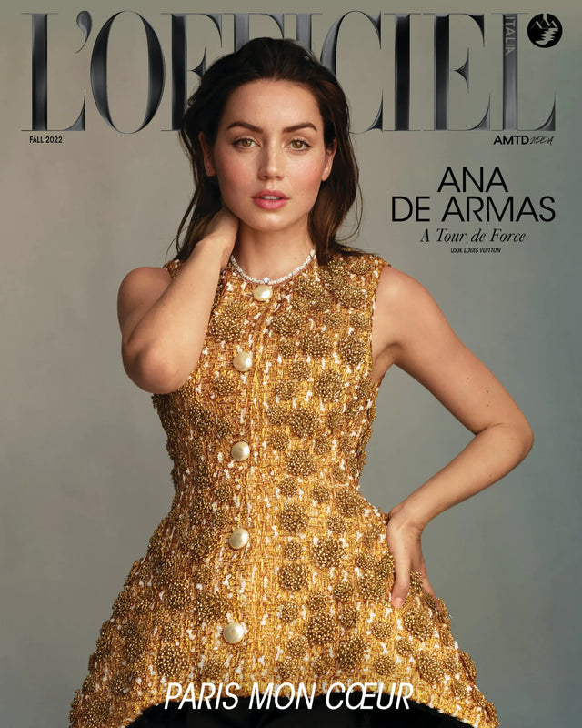 Woman in ornate gold dress on a magazine cover