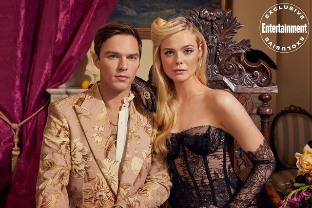 Portrait of a man and woman in ornate attire beside velvet curtains
