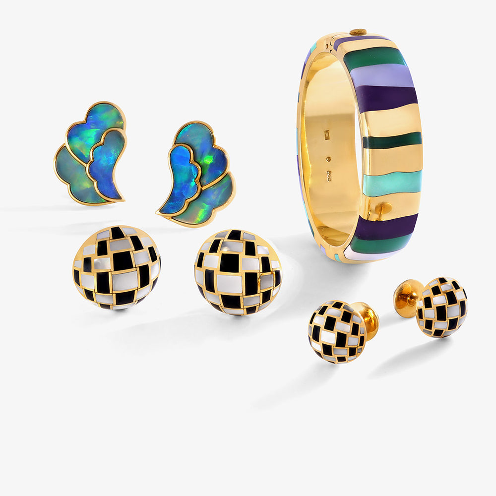 Tiffany gold & multicolored bangle, pair of black, white, and gold Tiffany stud earrings, and blue and green with gold trim earrings