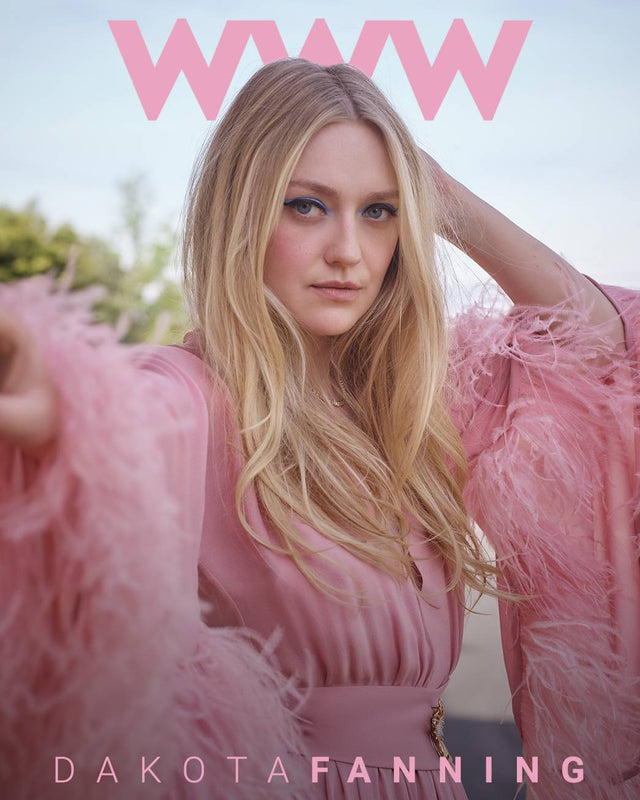 Portrait of a blonde woman in a pink feathered outfit