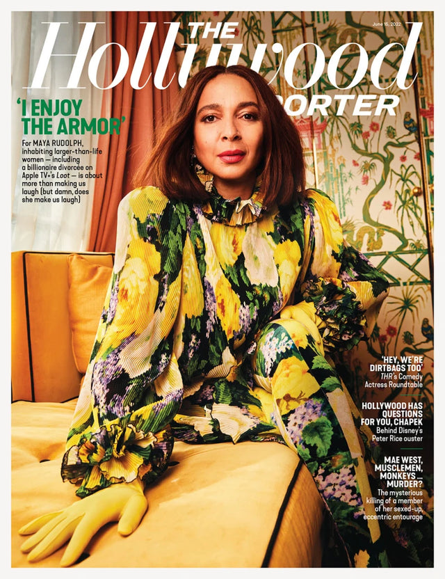 Woman in a colorful floral dress seated on a magazine cover