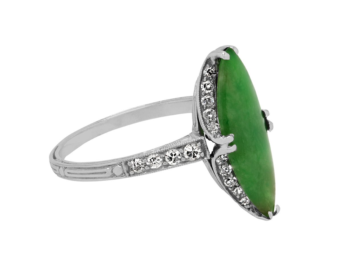 Side view of platinum ring with green jade and diamond shoulders