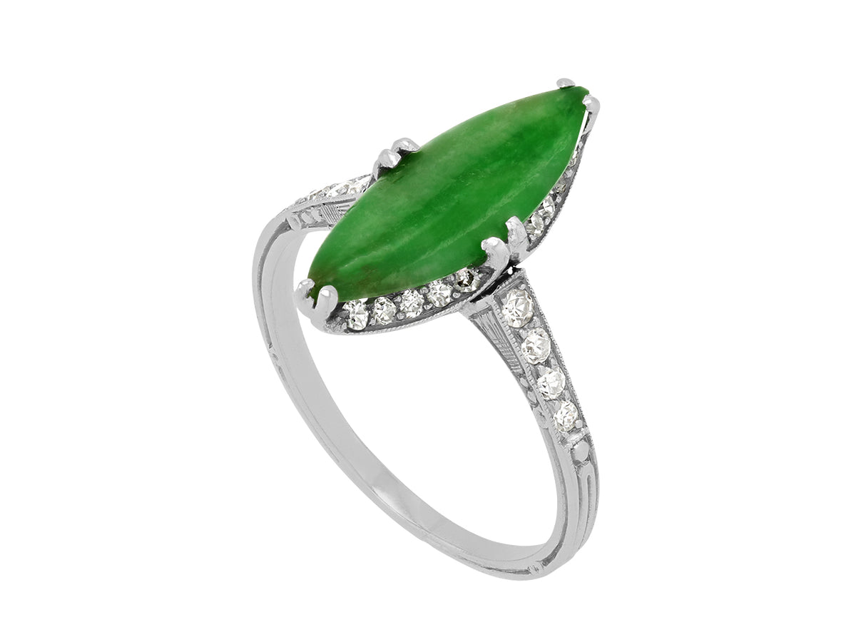 Platinum ring with green jade and diamond set shoulders