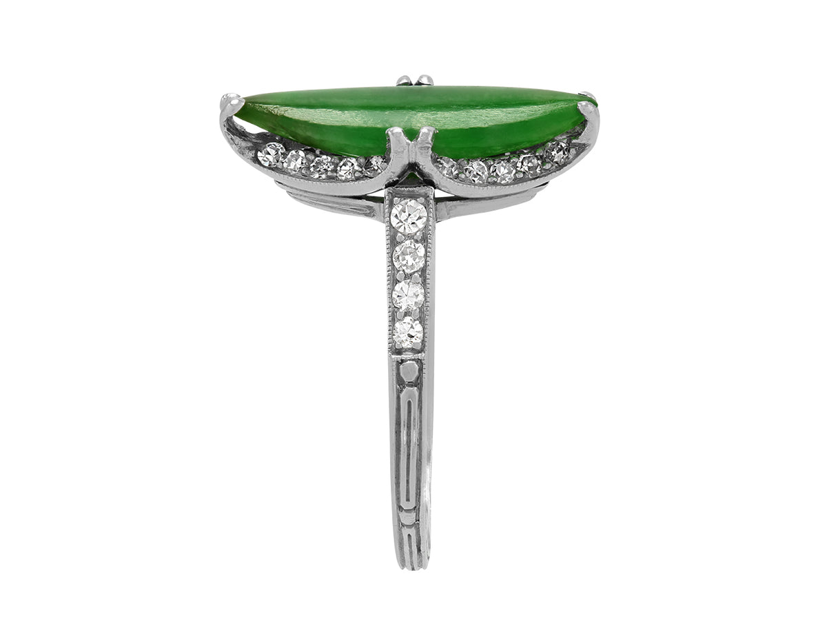 Side view of a platinum ring with green jade and diamonds