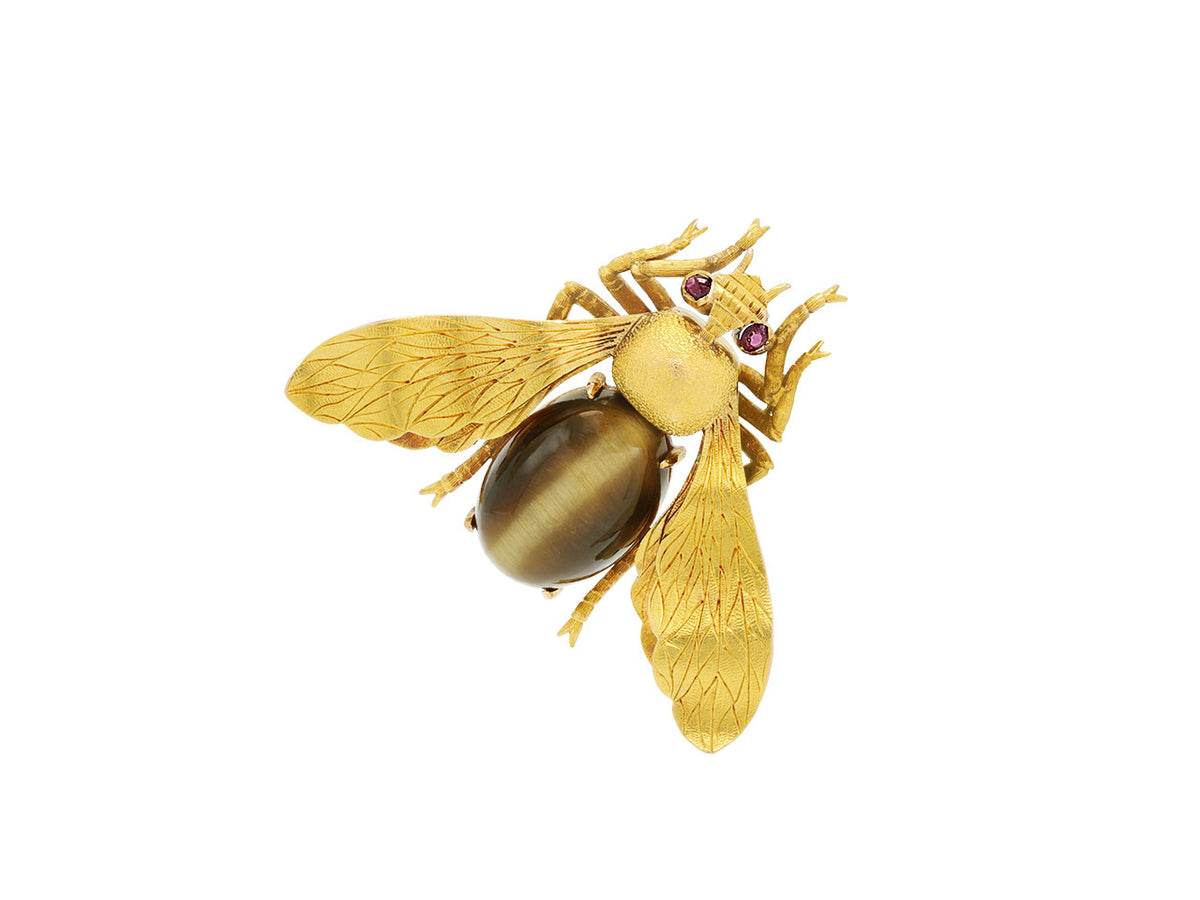 18k gold fly brooch with tiger eye body and ruby eyes