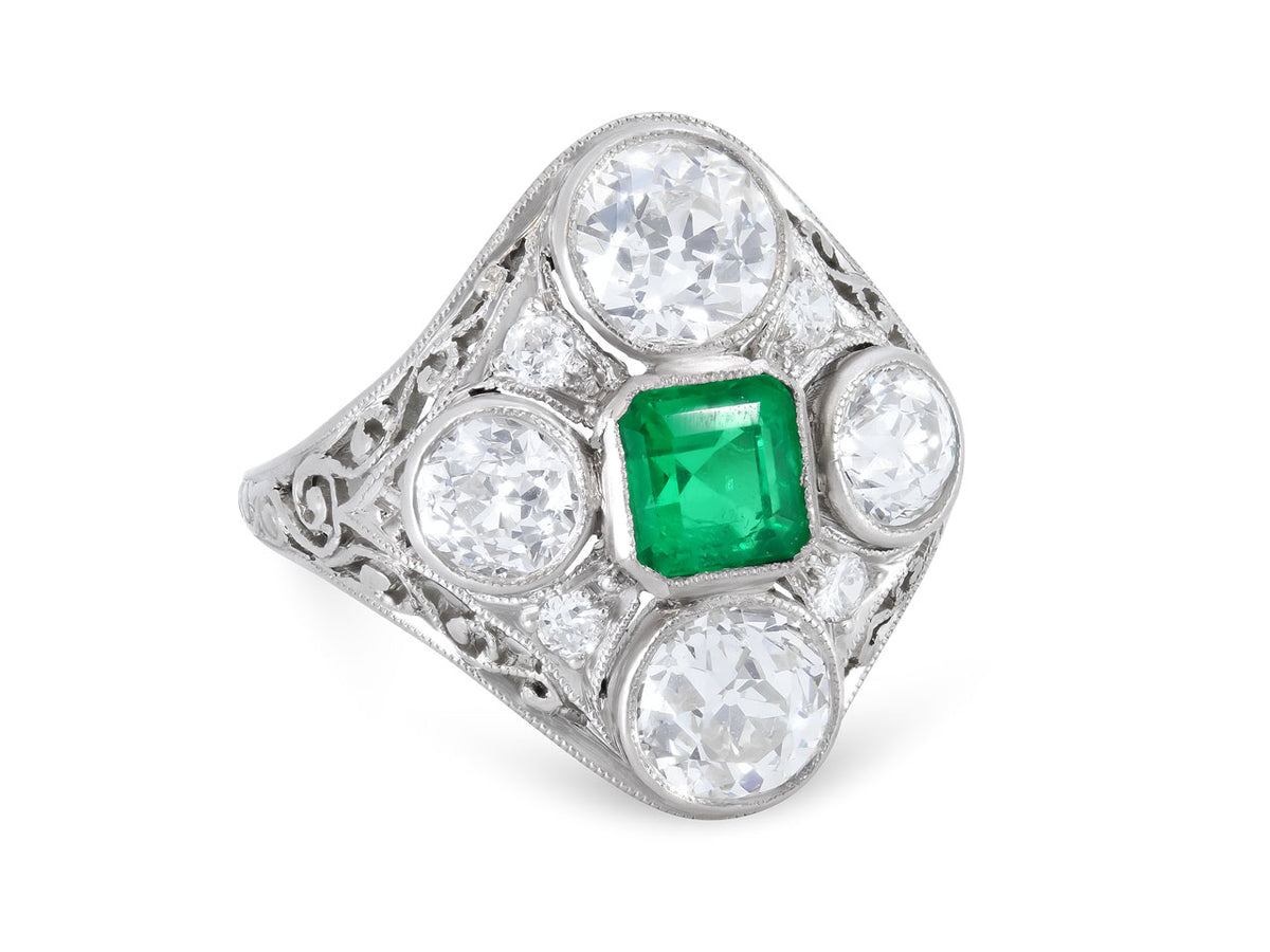 Platinum ring with square emerald and four diamonds