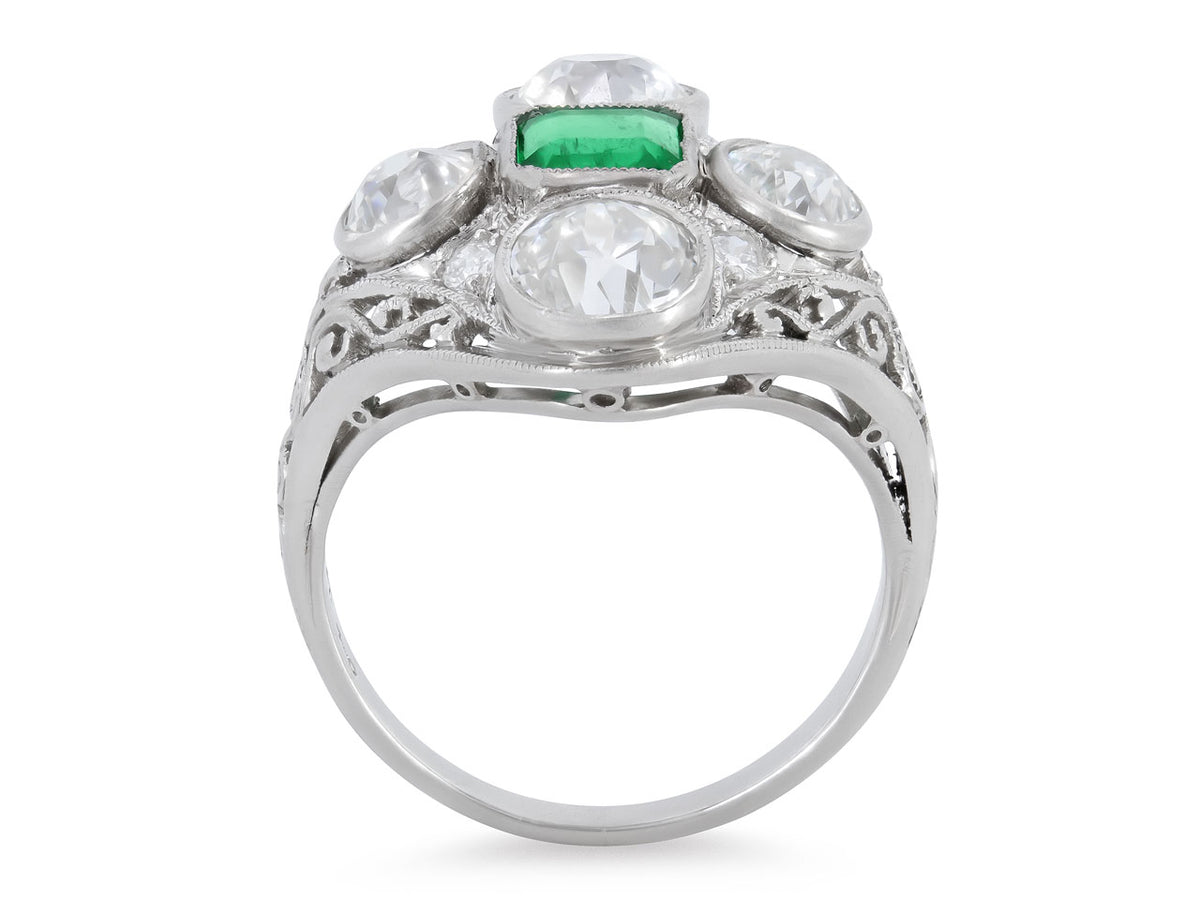 Side view of an Edwardian platinum ring with emerald and diamonds