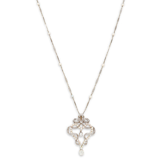 Diamond and pearl cross pendant necklace