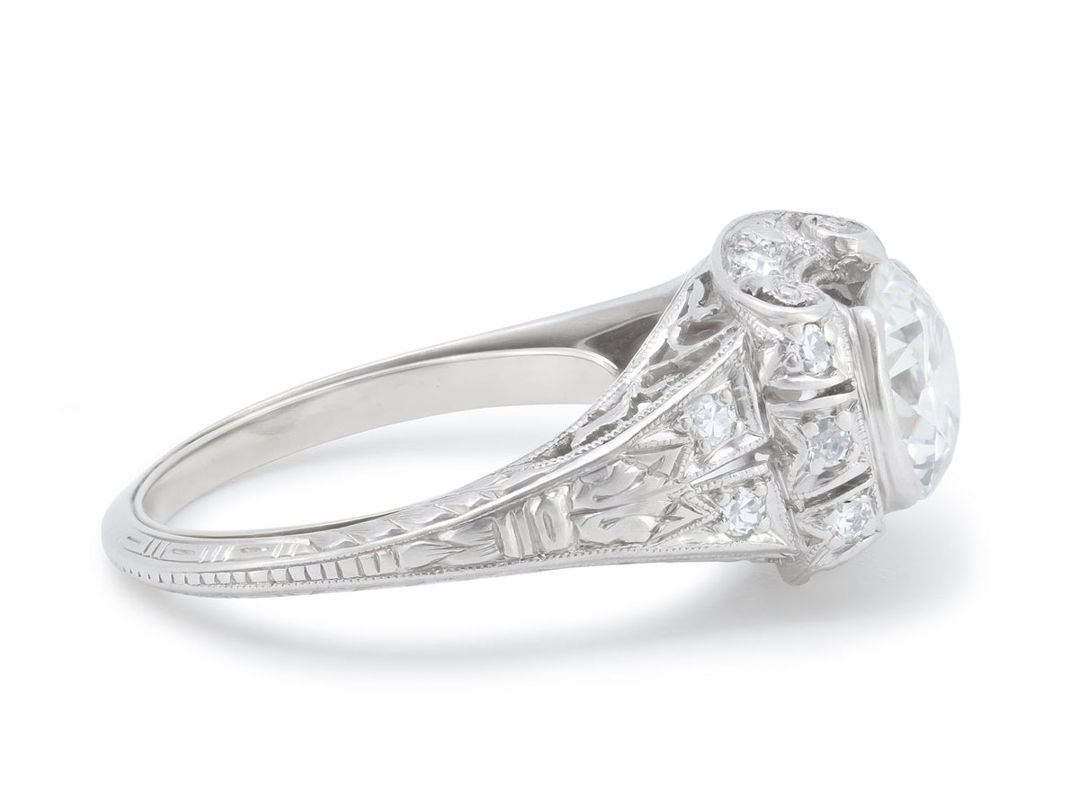 Side view of an Art Deco platinum diamond ring with foliate details