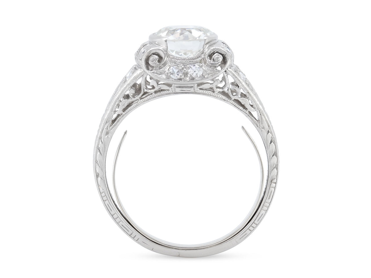 Side view of platinum ring with scrolling diamond setting