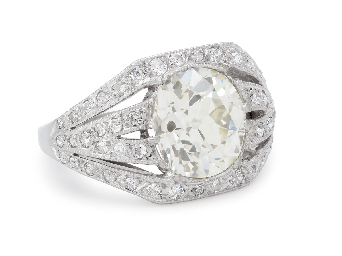 Platinum Art Deco ring with oval diamond and millegrain detail