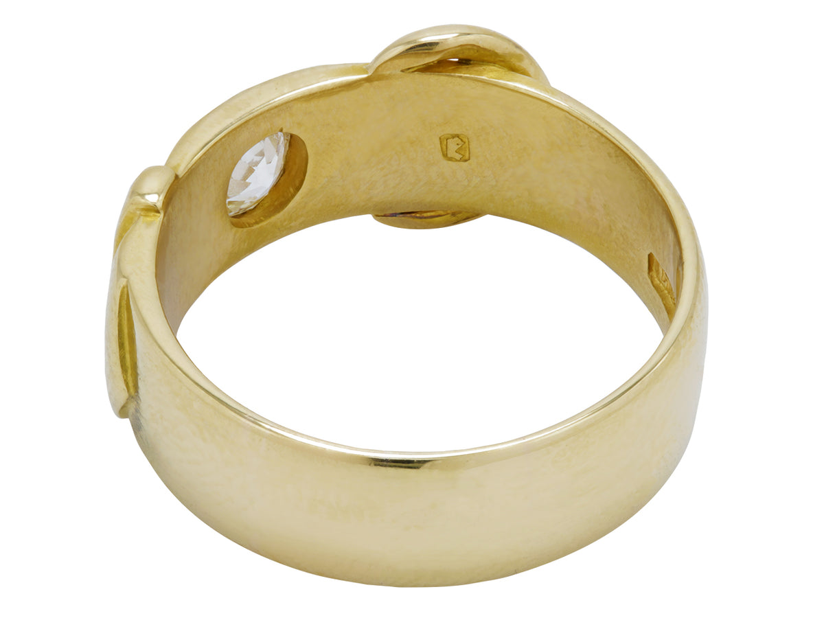 Interior view of an 18K gold buckle ring with diamond