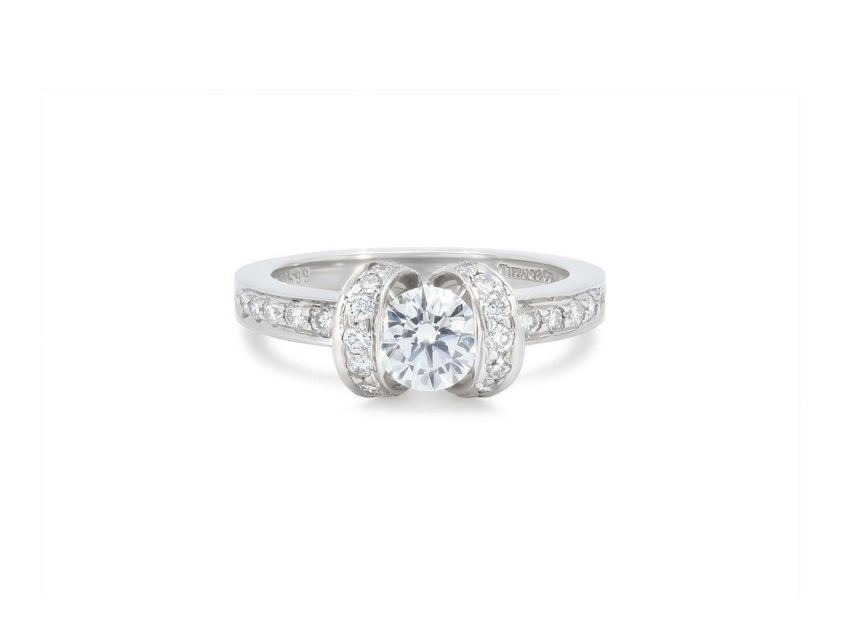 Platinum diamond ribbon ring with central round diamond