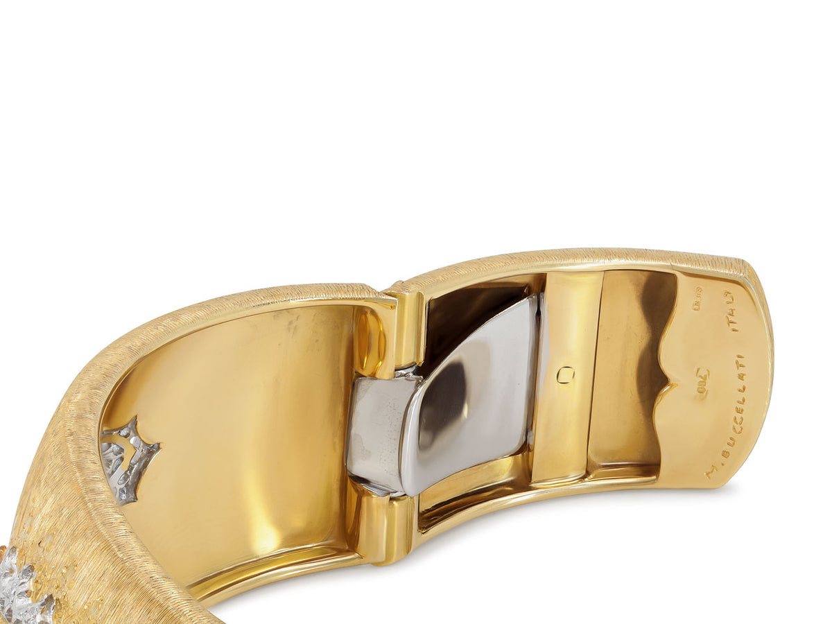Interior view of an 18K gold hinged cuff bracelet