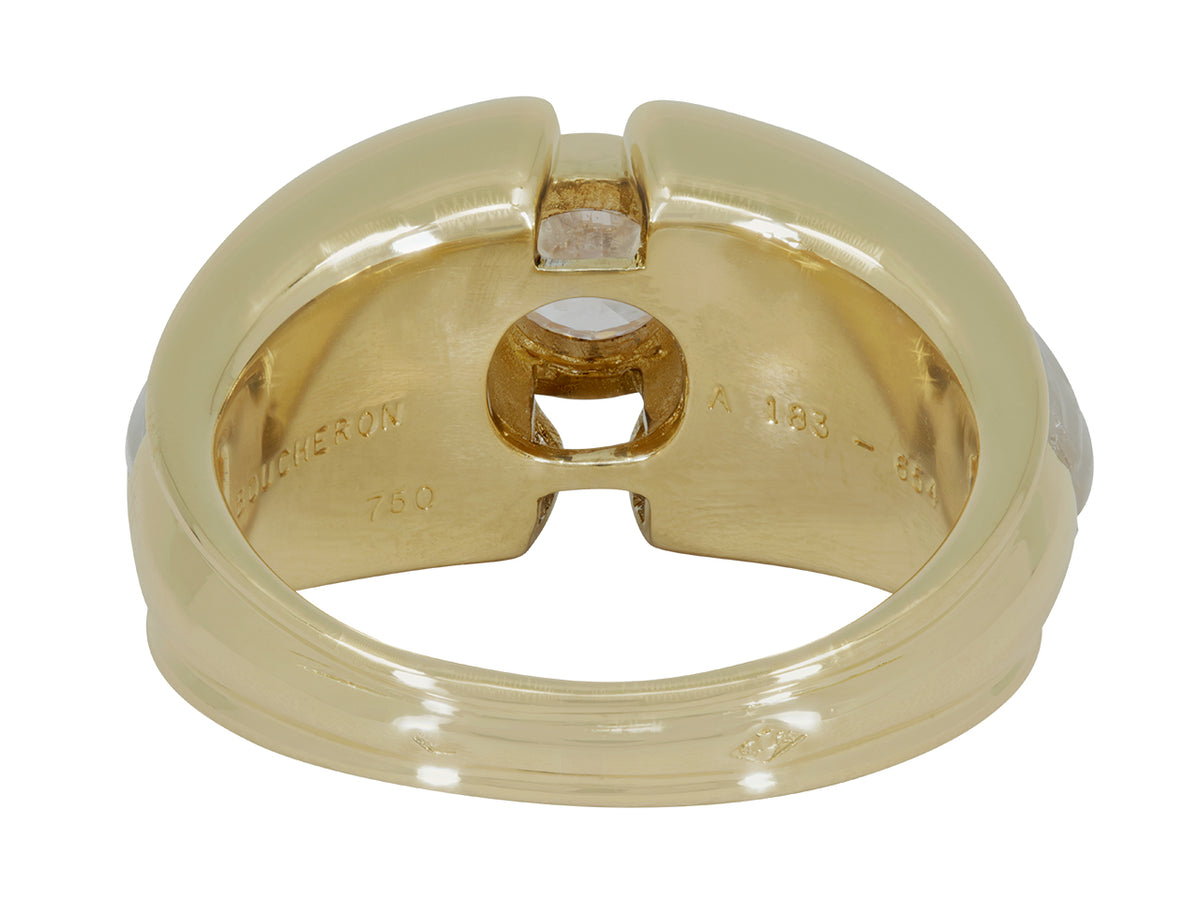 Underside of an 18k yellow gold ring with crystal shoulders