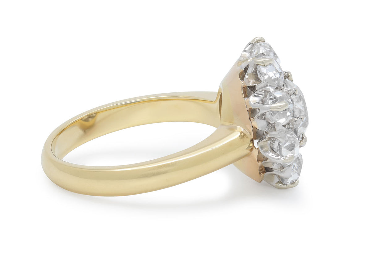 Side view of an antique diamond cluster ring in gold