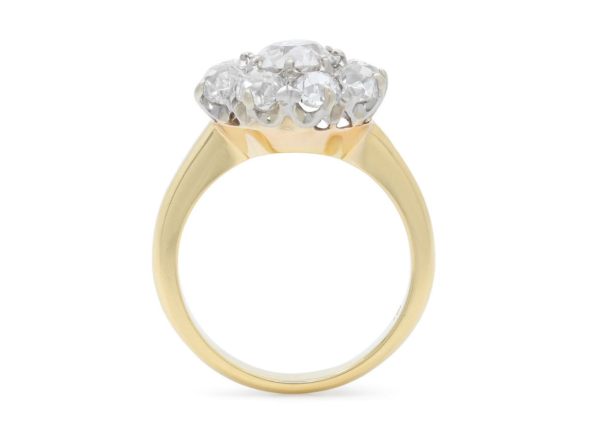 Side view of an 18K gold diamond cluster ring