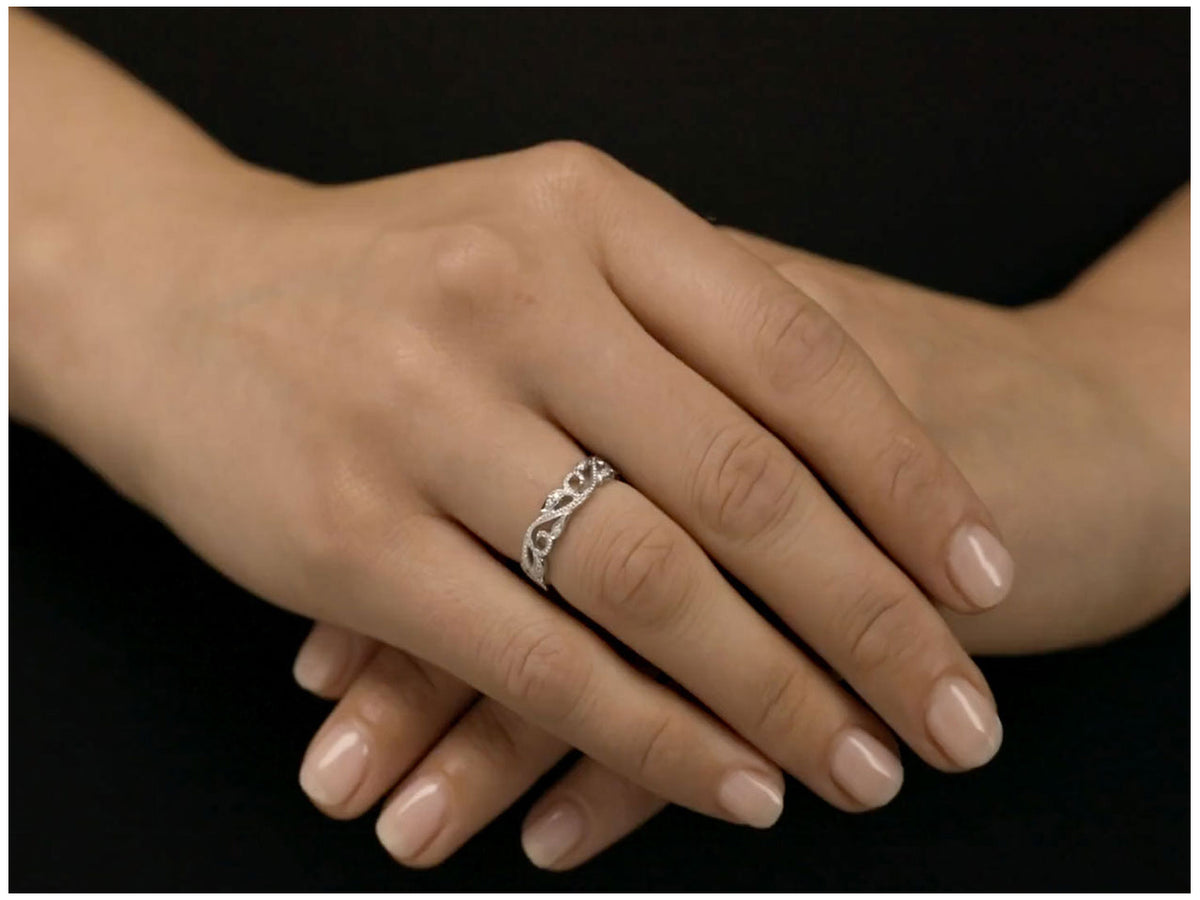 Diamond ivy vine ring in white gold worn on hand